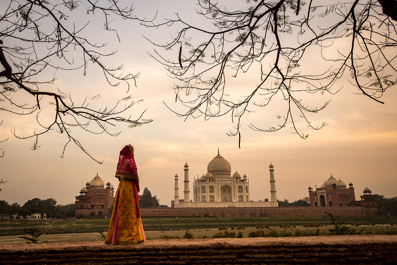 Woman standing outside Taj mahal India