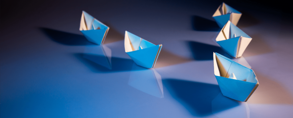 paper boats on a surface