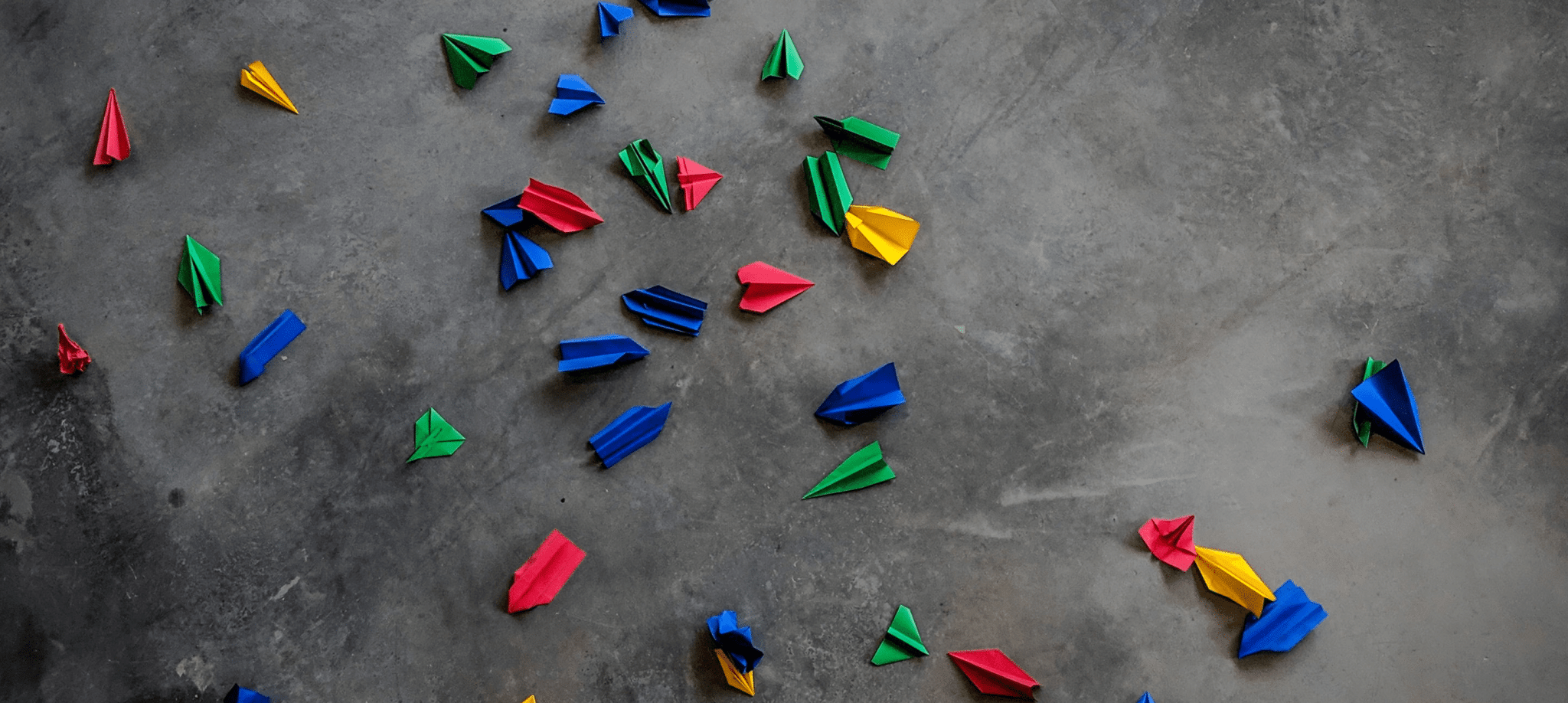 paper plane on grey surface