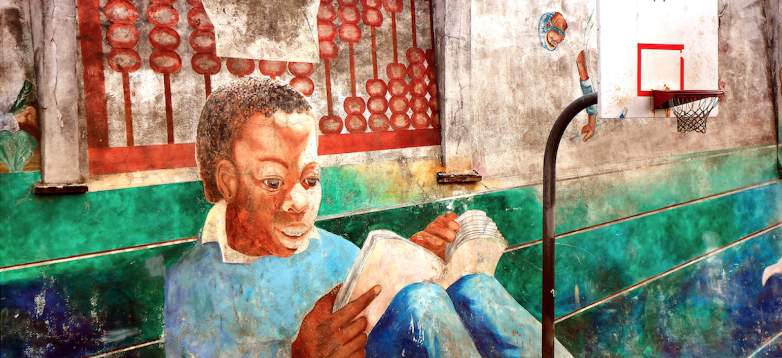 Photo of a painted wall in San Francisco (a boy studying in a playground)